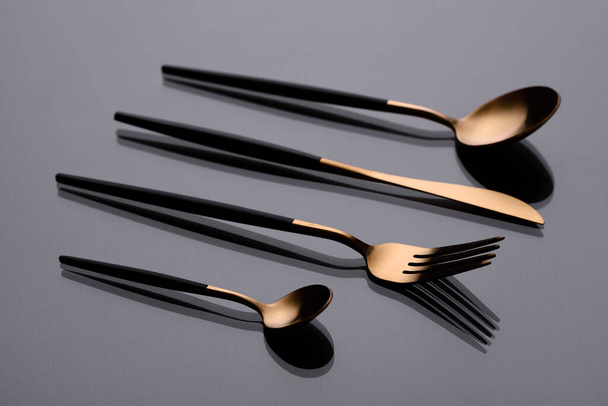 Cutlery on a gray background with shadow. Table serving. Preparing for Dinner - Foto, Imagem