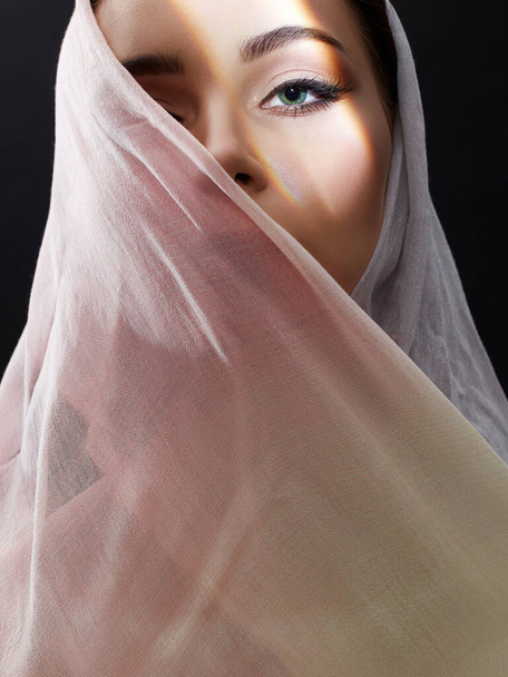 beautiful young woman in pink hijab. beauty girl in sunlight. fashion oriental style woman. ethnic people - Fotó, kép