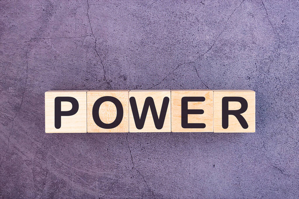 POWER word made with wood building blocks. - Foto, Bild