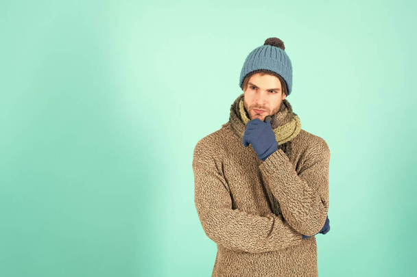 Seriously handsome and awesome. Handsome man with serious look. Thoughtful young man. Bearded man in winter style. Fashion and style. Winter trends. Caucasian man blue background, copy space - Photo, image