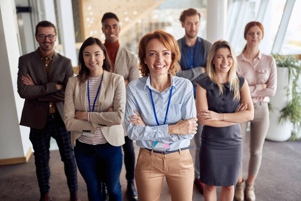 bold and outgoing group of successful business people, looking at camera with team leader in front . eye contact, looking at camera, smiling - Fotoğraf, Görsel