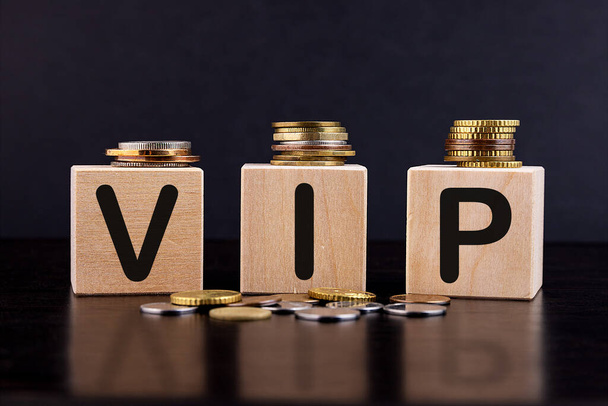 VIP - Business concept on cubes and coins - Foto, Bild