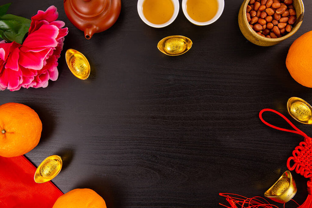 Flat lay Chinese new year mandarin orange and tea water with top view Copy space  for celebrate china festival.Chinese characters ZHAO CAI JIN BAO in the article refer to lucky fortune ,wealth, rich - 写真・画像