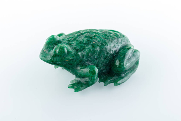 beautiful figurine of a toad made of malachite on a white background close-up - Photo, Image