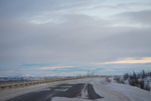 dawn on a winter road with clouds - Фото, зображення