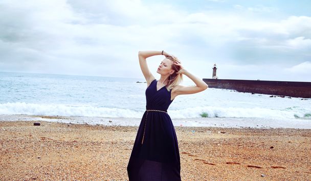 Summer photo of blonde girl on beach. - Φωτογραφία, εικόνα