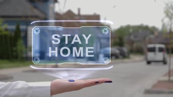 Weibliche Hand zeigt Hologramm Stay Home - Filmmaterial, Video