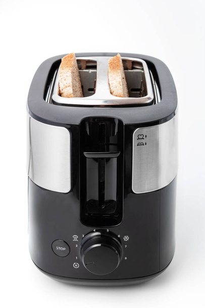 Toaster black color isolated on white background, with bread front view - Photo, Image