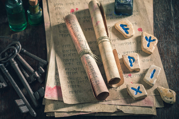 Original rune stones based on futhark alphabet on old table - Zdjęcie, obraz