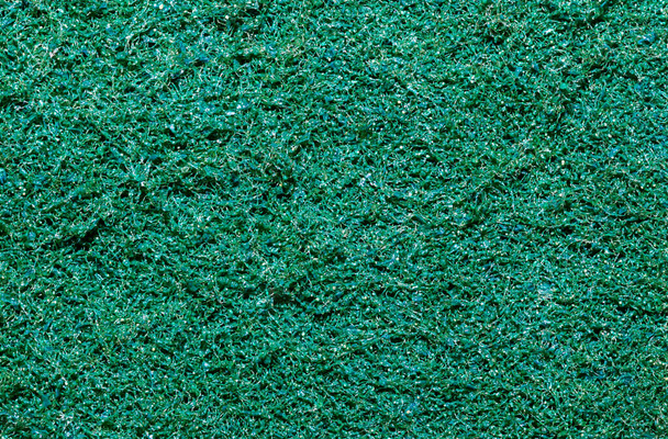 Vista dall'alto astratta di sfondo fibra sintetica verde. Immagine del primo piano. - Foto, immagini