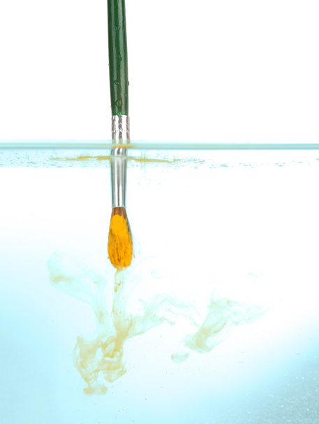 Brush with color paint in water - Fotó, kép