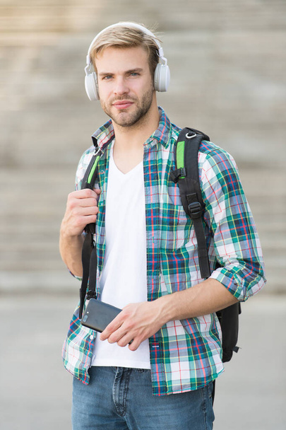 appealing look. school life. Listen music. Modern and digital youth. trendy man. College student earphones smartphone. Online education. Audio book concept. Educational technology. student e learning - Fotó, kép