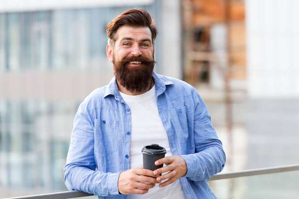 Life happens after coffee. Happy hipster drink takeaway coffee. Bearded man enjoy drinking coffee outdoor. Take away coffee habit. Hot morning drink. Breakfast - 写真・画像
