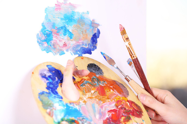 Artist paints picture close-up - Фото, изображение