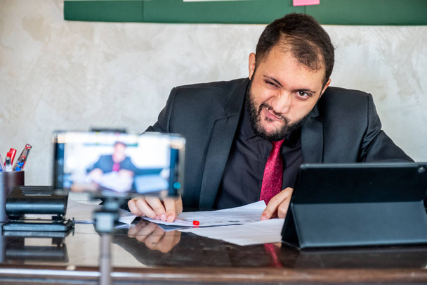 Happy male coach teacher webinar speaker looking at camera giving online class lecture or making conference video chat call, smiling businessman entrepreneur recording video training, webcam view - Photo, Image