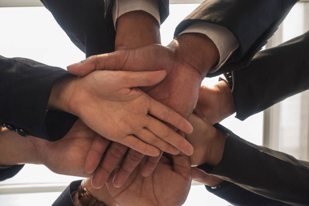 Hand business team overlapping view below.Teamwork Concept. - Zdjęcie, obraz