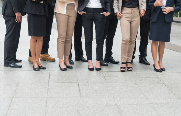 The legs of a group of businessmen standing in modern city. - Fotó, kép