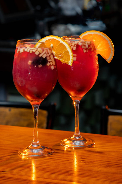 Two Clericot cocktails with an oragnge slice and fruit - Photo, Image