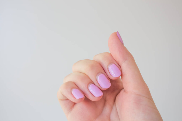 Regrown manicure. Female hand with regrown nails before correcting gel polish. Well-groomed hands. copy space trending. Place for text. - Foto, immagini