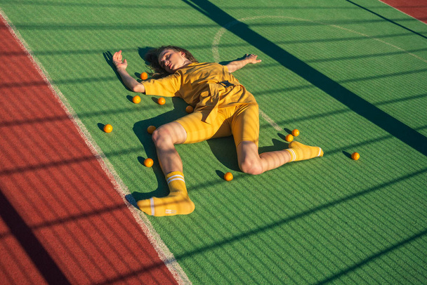Phots shot of a young woman on a sport playgroun - Valokuva, kuva