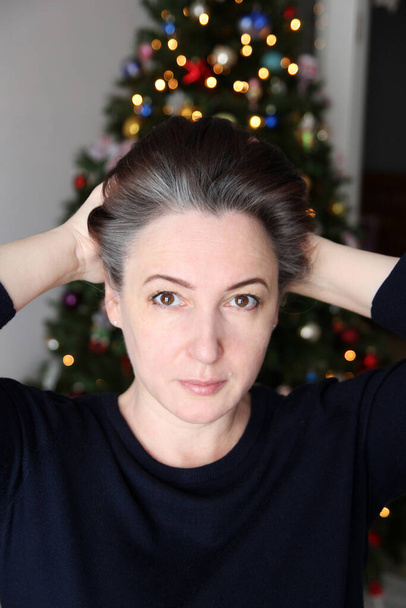 A woman with regrown gray hair roots. Natural gray hair. The Silver Sisters. Hair coloring. Hair dye. Young gray hair - Photo, Image