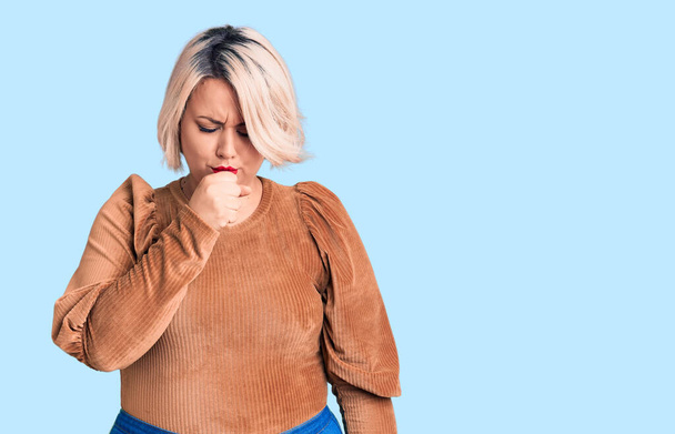Young blonde plus size woman wearing casual sweater feeling unwell and coughing as symptom for cold or bronchitis. health care concept.  - Photo, Image