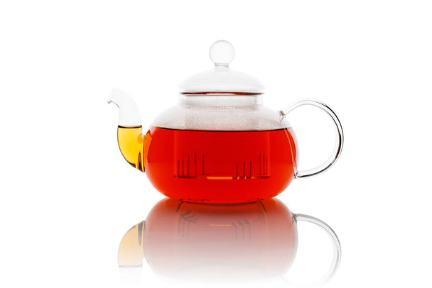 Tea pot with fresh black tea isolated on white background - Photo, Image