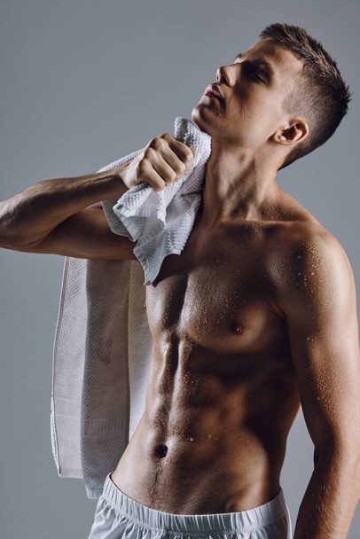 male bodybuilders pumped up torso towels lifestyle fitness - Fotó, kép