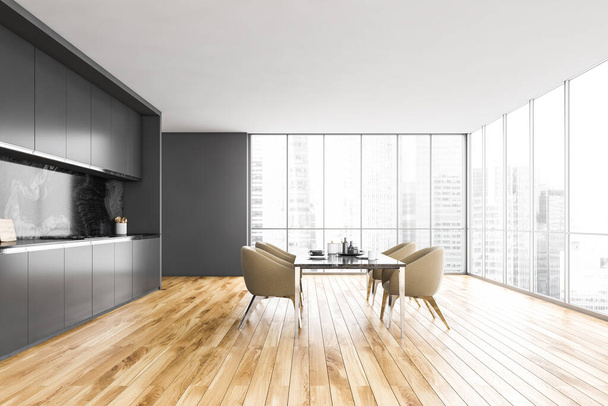 Black and white minimalist kitchen, black table and beige chairs near window with city view. Modern new kitchen on dark parquet floor, 3D rendering no people - 写真・画像