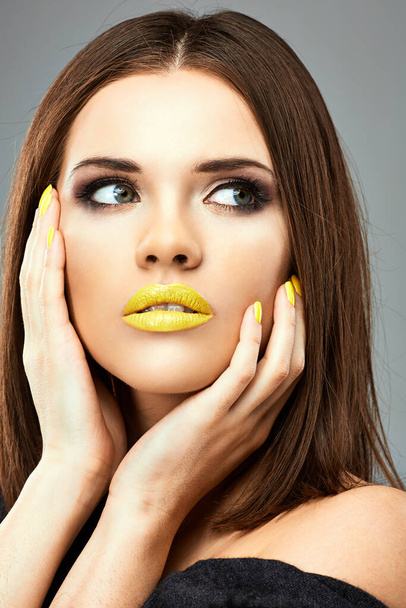 Close up face girl with yellow lips. Isolated gray background. - Φωτογραφία, εικόνα