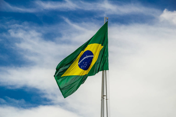 Brazilian flag flying and fluttering in the wind. - Fotoğraf, Görsel