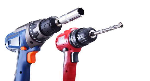 A screw gun and a pistol-grip cordless drill isolated on white background - Photo, Image