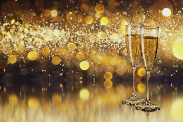 Glasses with champagne and copy space for text on blurred yellow lights. - Foto, immagini