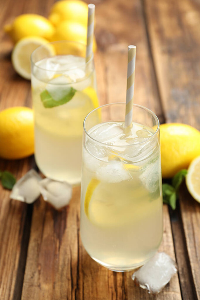 Natural lemonade with mint on wooden table. Summer refreshing drink - Foto, imagen