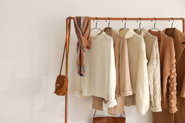 Rack with stylish women's clothes indoors. Modern interior design - Φωτογραφία, εικόνα