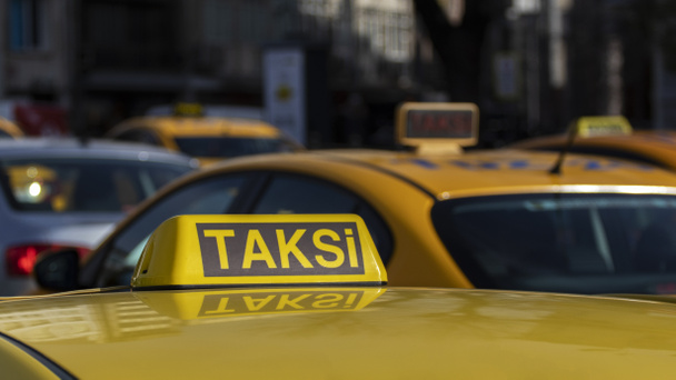 Close up of Istanbul taxi. Many taxis on street. The word "taksi" translated from Turkish means "taxi". - Photo, Image