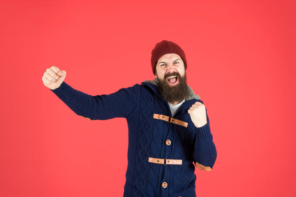 Happiness. Man bearded hipster stylish fashionable jumper and hat. Emotional expression. Casual clothes for winter season. Hipster with long beard. Hipster lifestyle. Stylish outfit hat accessory - Foto, Imagem