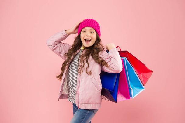 Best deal. Sales and discounts. Home shopping. Small girl with shopping bags. Little girl with gifts. Winter shopping. Buyer consumer concept. Christmas sale. Kid fashion. Holiday purchase saving - Foto, imagen