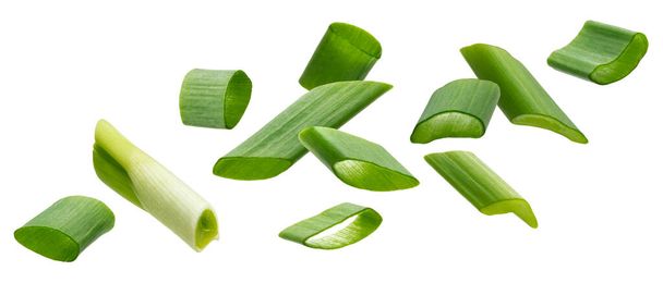Falling green onion slices, cut chives isolated on white background - Photo, Image