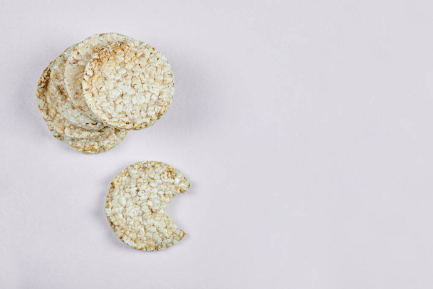 Stack of rice crackers on white background - Φωτογραφία, εικόνα