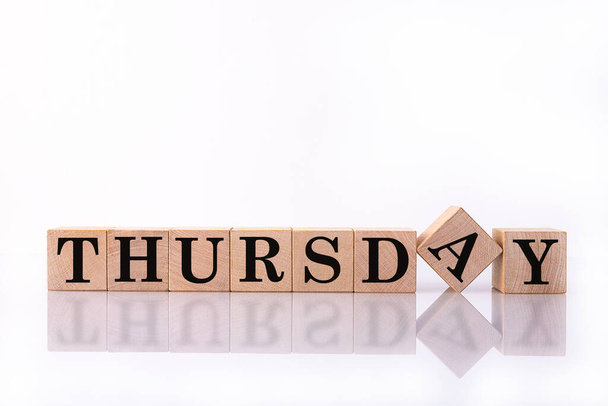 The word Thursday on wooden cubes. Weekday concept. - Фото, зображення
