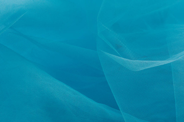 texture azzurra utilizzata come sfondo. Tessuto leggero blu. Tessitura di pelliccia sintetica blu close-up - Foto, immagini