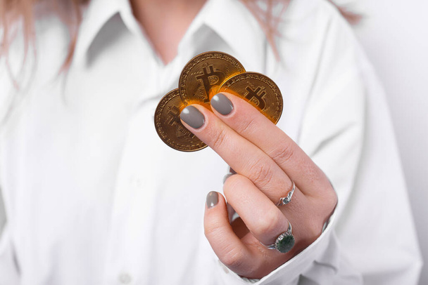 Close up photo of woman hand holding bitcoins - Φωτογραφία, εικόνα