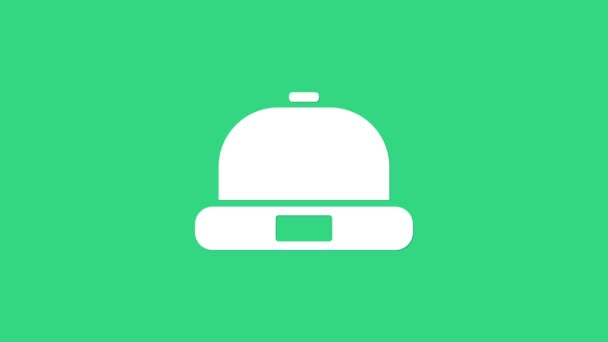 緑の背景に隔離された白いビーニー帽子のアイコン。4Kビデオモーショングラフィックアニメーション - 映像、動画