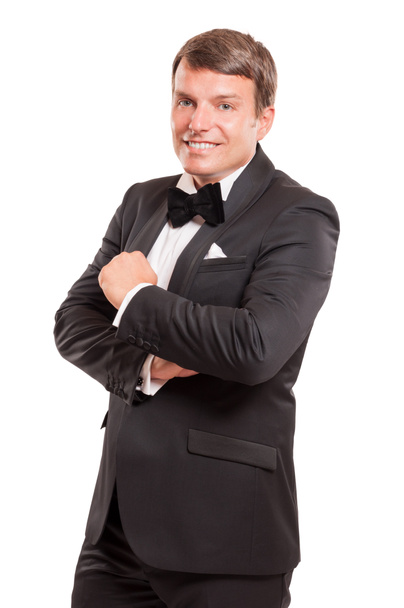 Male model wearing a tuxedo isolated on white backgroun - Φωτογραφία, εικόνα
