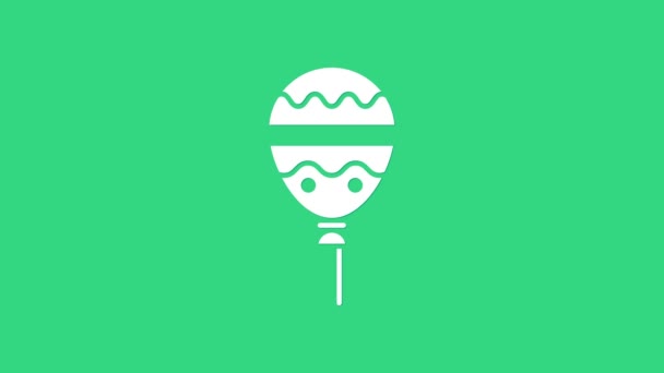 Fehér léggömbök szalag ikon elszigetelt zöld alapon. Boldog Húsvétot! 4K Videó mozgás grafikus animáció - Felvétel, videó