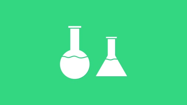 Tubo de ensayo blanco e icono del frasco aislados sobre fondo verde. Prueba química de laboratorio. Artículos de vidrio del laboratorio. Animación gráfica de vídeo 4K - Metraje, vídeo