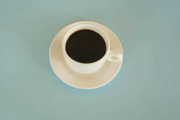 a cup of black coffee on the table - Fotó, kép