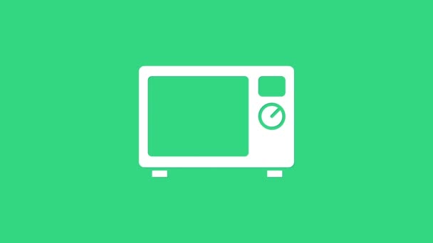 緑色の背景に分離された白い電子レンジのアイコン。家電製品のアイコン。4Kビデオモーショングラフィックアニメーション - 映像、動画