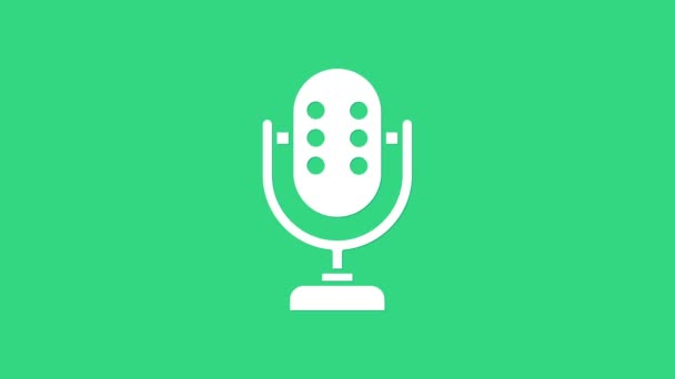 Icono del micrófono blanco aislado sobre fondo verde. En el micrófono de radio de aire. Firma del portavoz. Animación gráfica de vídeo 4K - Imágenes, Vídeo